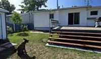 clean_siding_double_garden_painted_fence